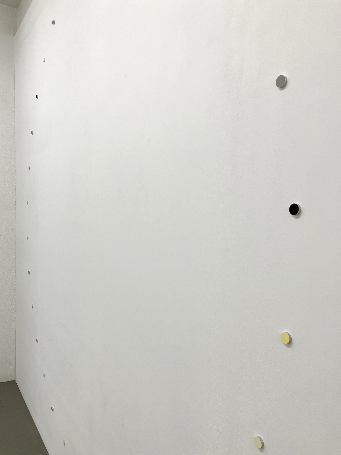 a small wheel, pigment, casein on aluminum, 22 x 6 mm (each), 250 x 250 cm (overall), 2025 (detail)<br><br>