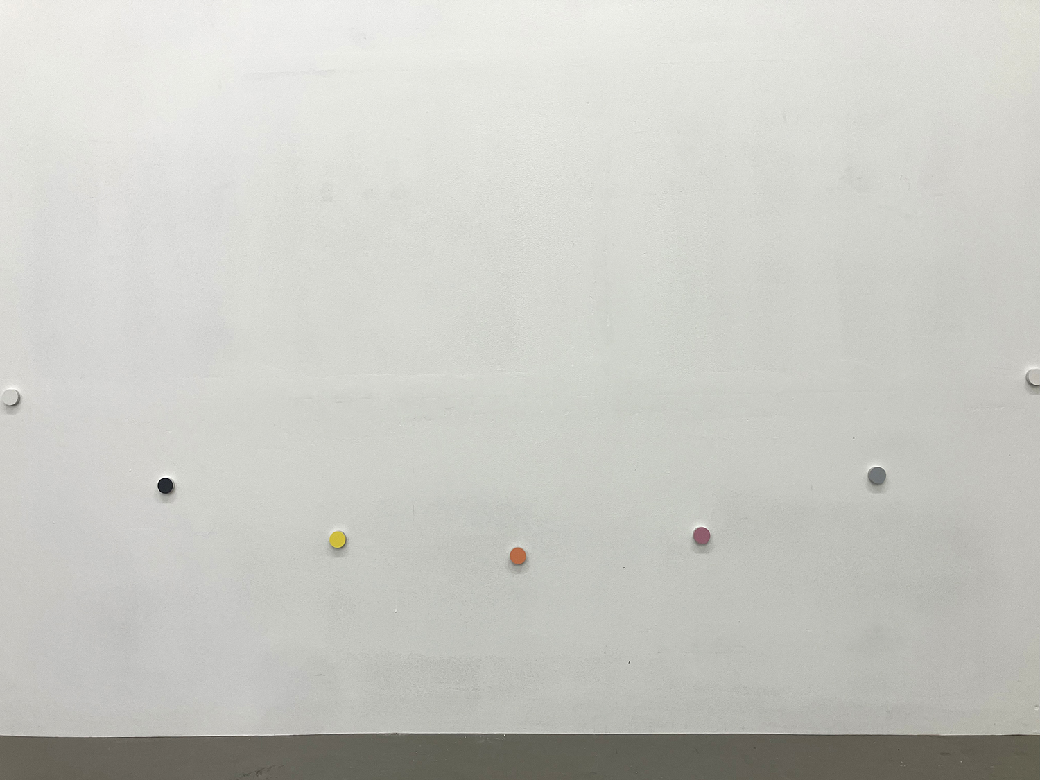 a small wheel, pigment, casein on aluminum, 22 x 6 mm (each), 250 x 250 cm (overall), 2025 (detail)<br><br>