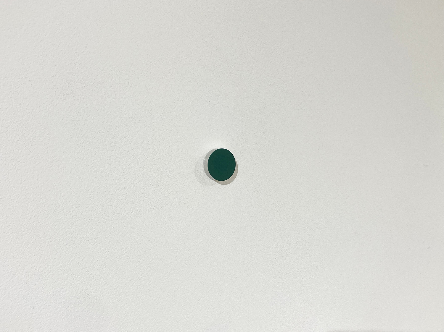 Green, pigment, casein on alumium, diameter 22 mm width 6 mm, 2007<br><br>