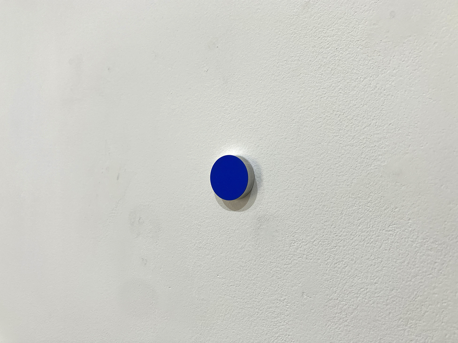 Blue, pigment, casein on alumium, diameter 22 mm width 6 mm, 2007<br><br>